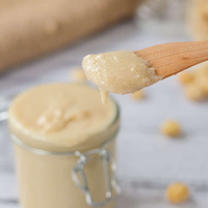 Macadamia Butter on a wooden scoop