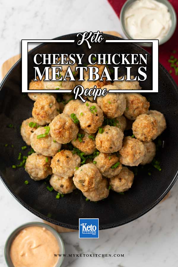 Low Carb Chicken Cheddar Meatballs in a dark bowl topped with chopped chives