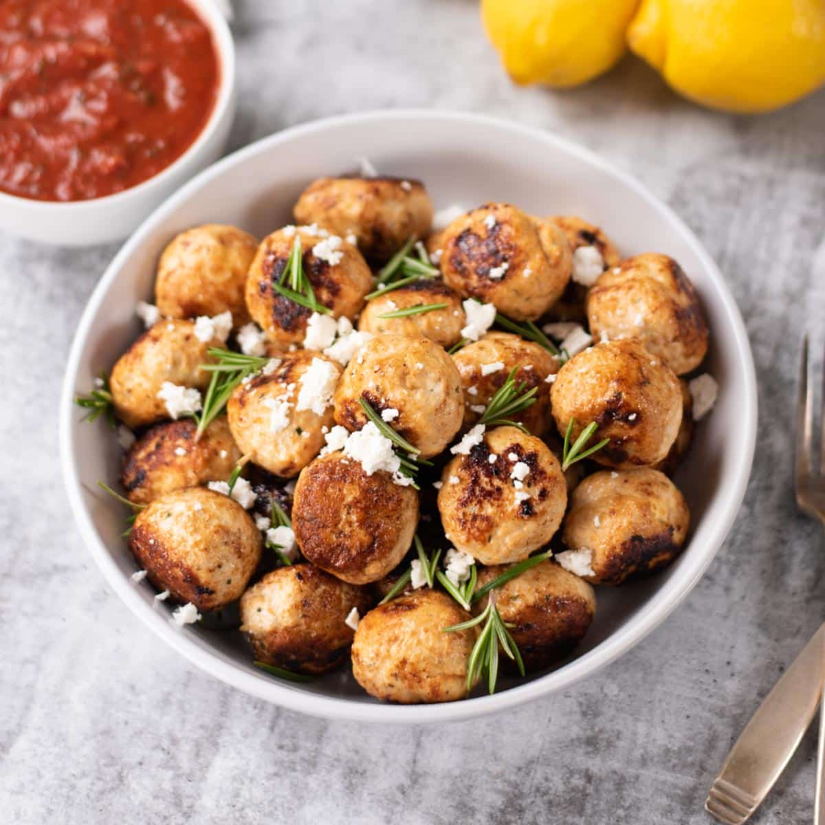 Keto chicken and feta cheese meatballs in a bowl.