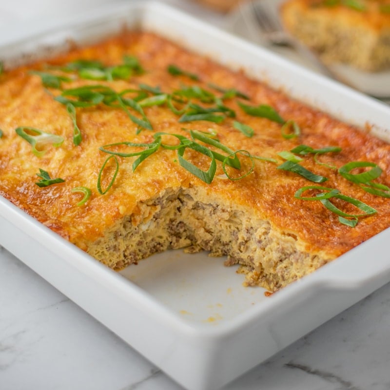 Keto Sausage Breakfast Casserole in a casserole dish with a slice missing
