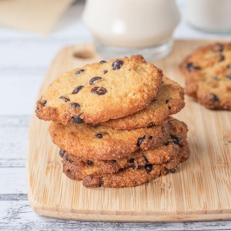 Keto Chocolate Chip Cookies stacked in a pile