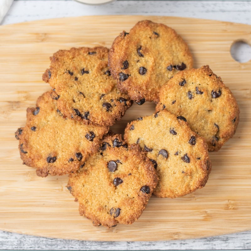 Keto Chocolate Chip Cookies place in a circle on a wooden platter