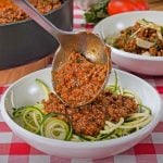 Keto spaghetti sauce poured over zucchini noodles.