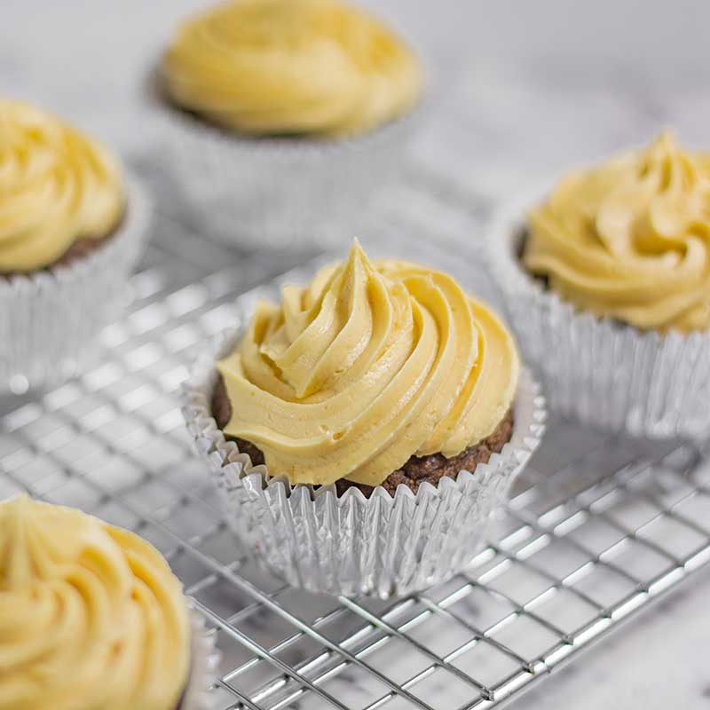 Keto Chocolate Peanut Butter Cupcakes on a cake rack