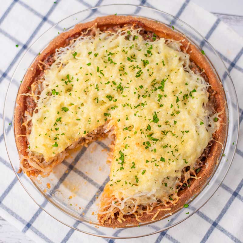 Keto Spaghetti Bolognese Pie Recipe with a slice removed