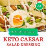 Keto caesar salad dressing on salad with text saying, "keto caesar salad dressing."