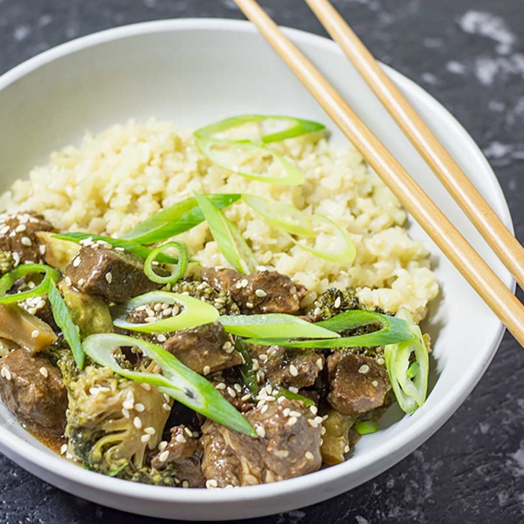 Beef and Broccoli in a bowl with cauliflower rice