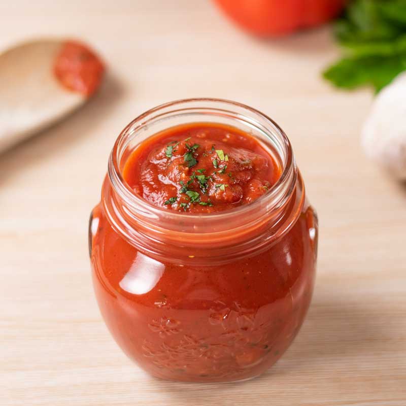 Keto Marinara Sauce in a glass jar.