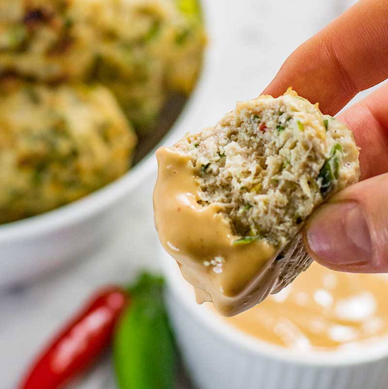 Keto Thai Chicken Meatballs dipped into the thai dipping sauce