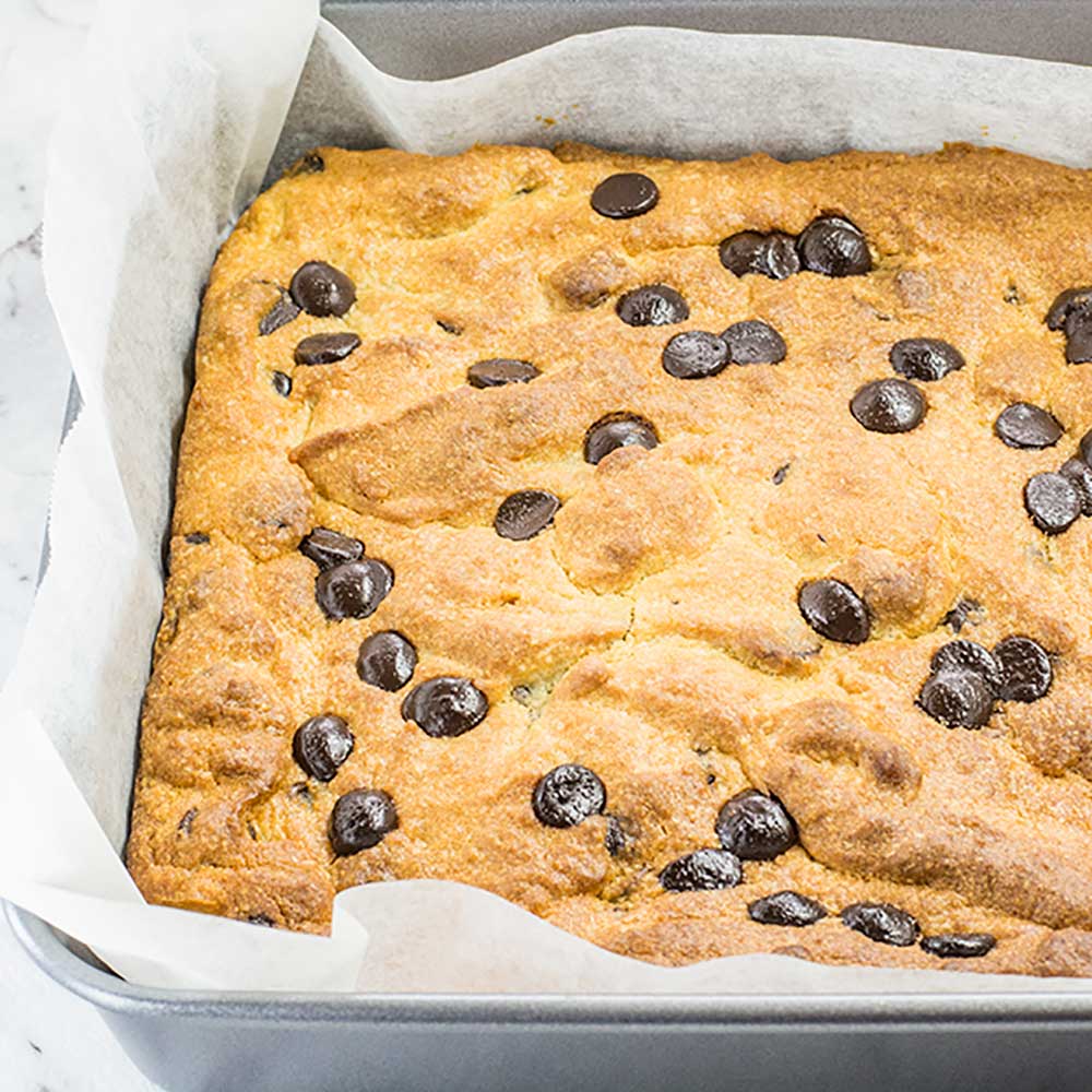 Keto Chocolate Chip Peanut Butter Blondies in a baking pan