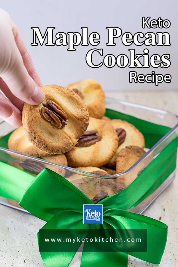 Keto Maple Pecan Cookies in a clear square container with a green ribbon