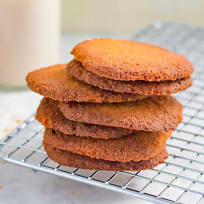 Keto ginger snap cookies on a baking rack.