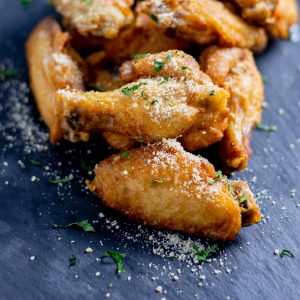 Chicken wings with parmesan cheese.