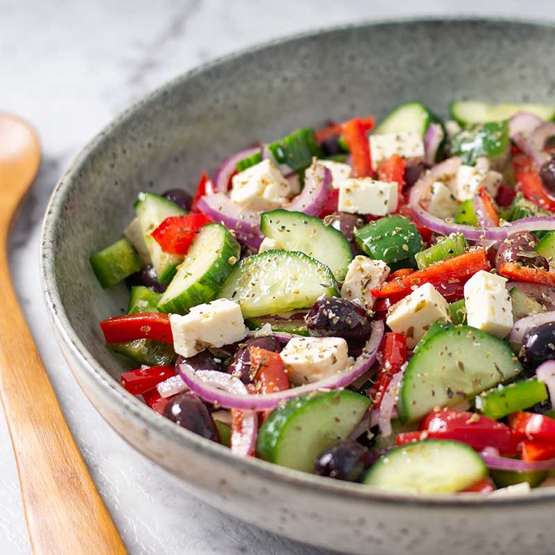 Keto greek salad in a salad bowl.