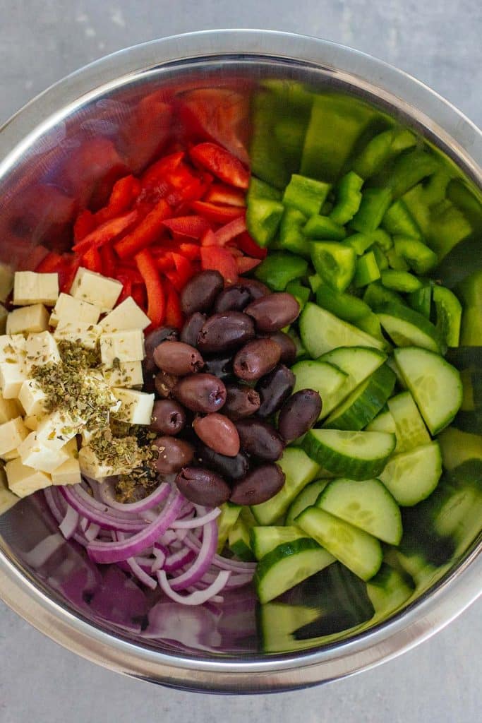 Keto Greek salad ingredients in a bowl.