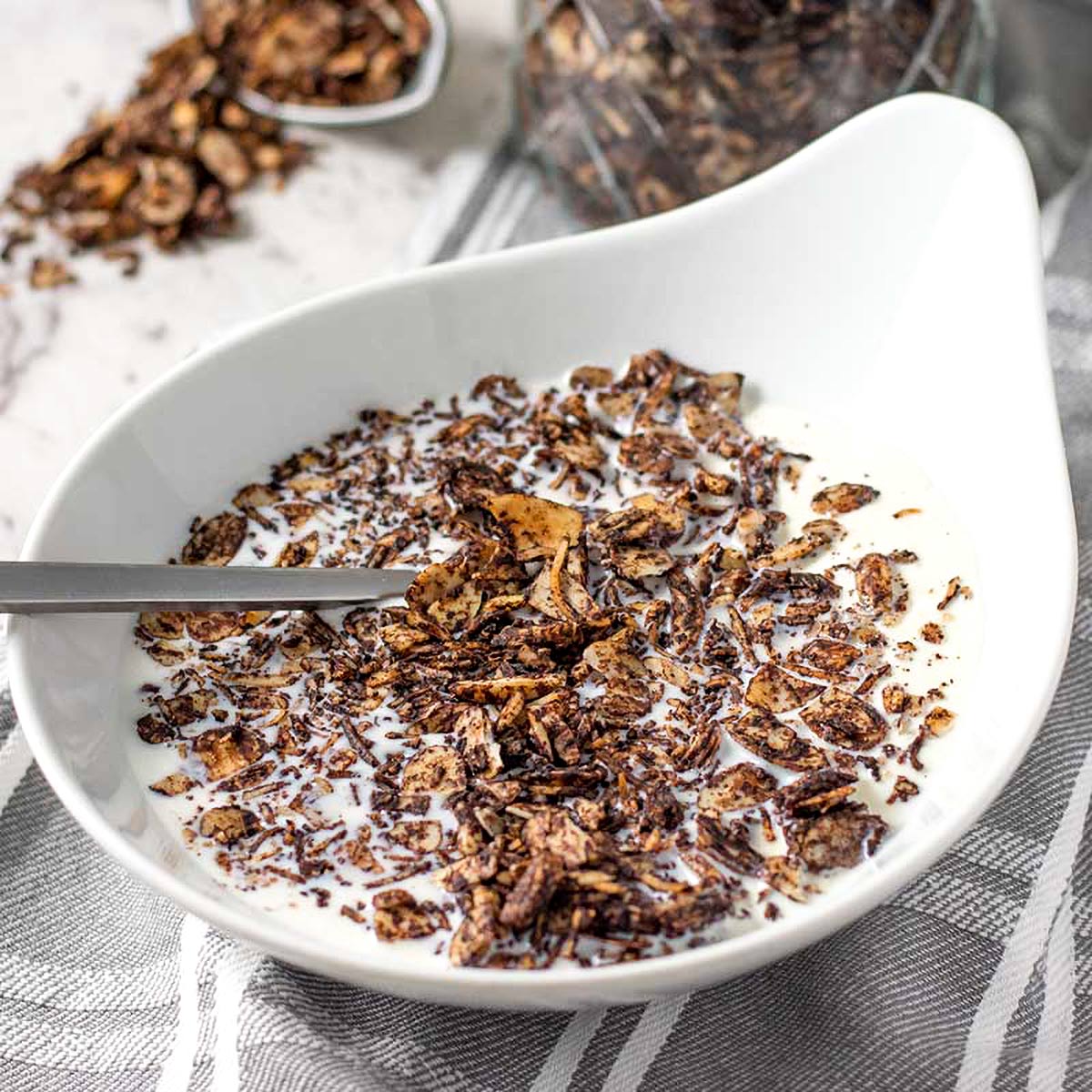 Keto almond granola in a white bowl.