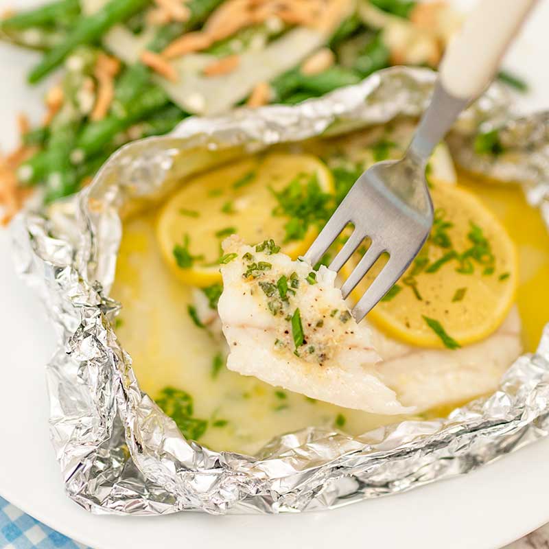 Lemon butter fish parcels in foil.