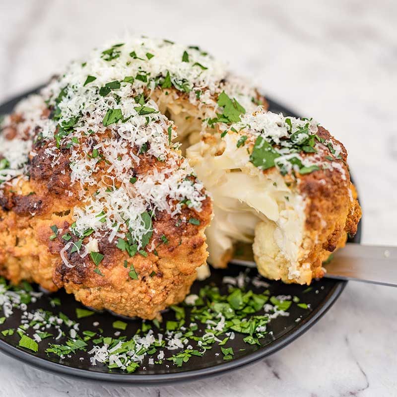 Whole Roasted Cauliflower with Garlic and Cheese