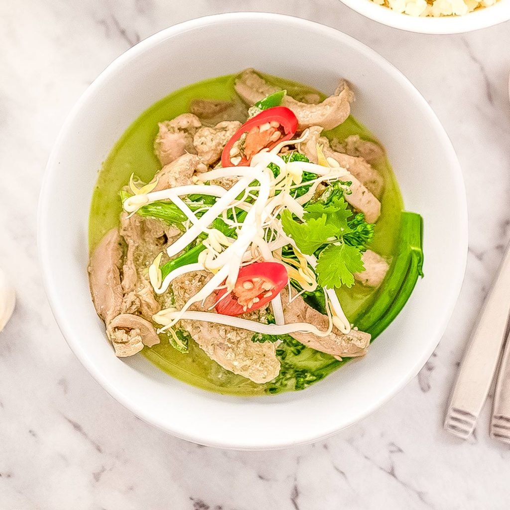 Keto Thai green chicken curry in a white bowl.