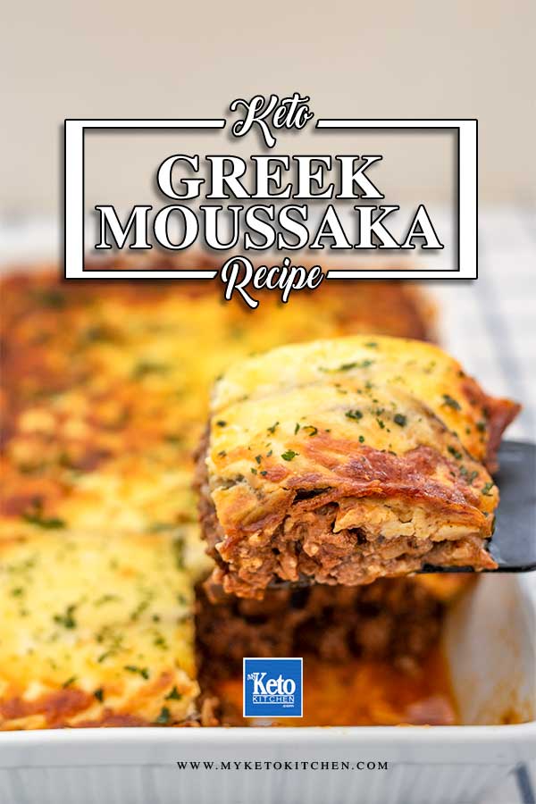 Image of a slice of Keto Moussaka being lifted out of the cooked casserole dish with a black spatula. The words "keto recipe", "greek moussaka" and "www.myketokitchen.com" are written over the image