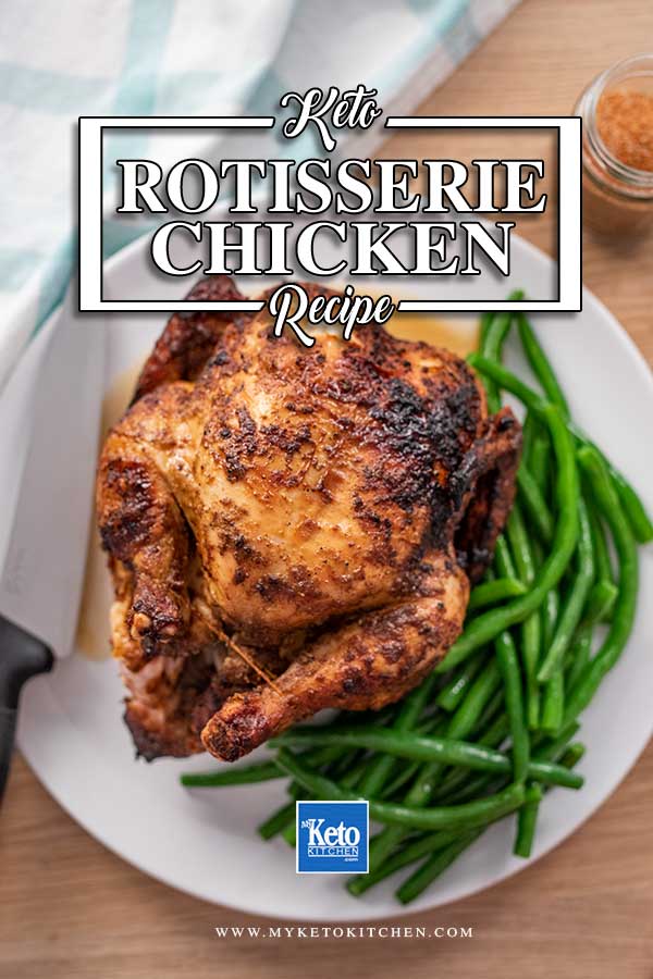 Image of a rotisserie chicken on a white plate with green beans around it on one side and a carving knife on the other.