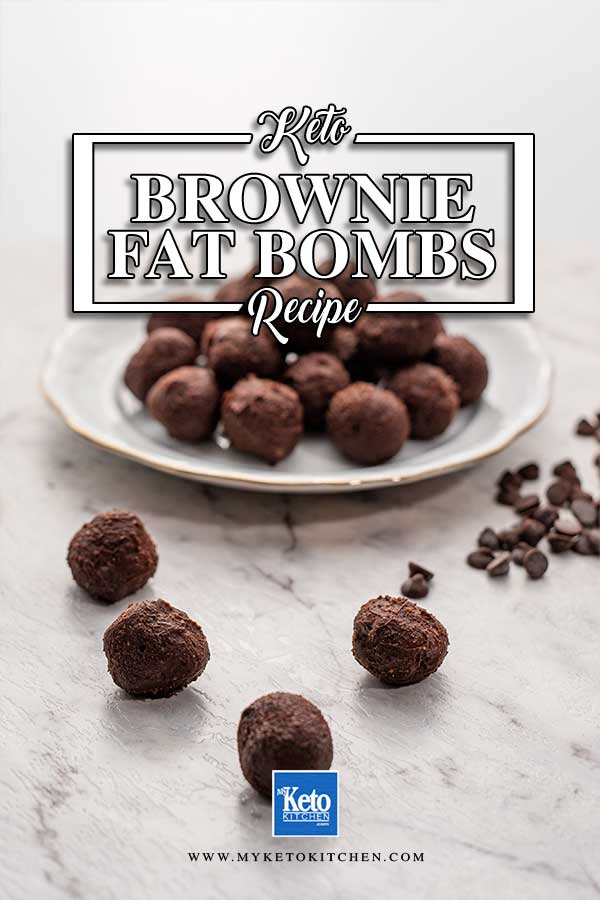 Image shows keto brownie fat bombs on a white marble bench with sugar free chocolate chips sprinkled around and some on a white plate