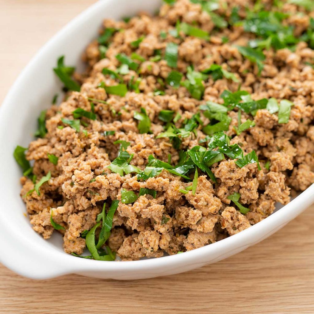 Sauteed Keto Italian Sausage in a white casserole dish