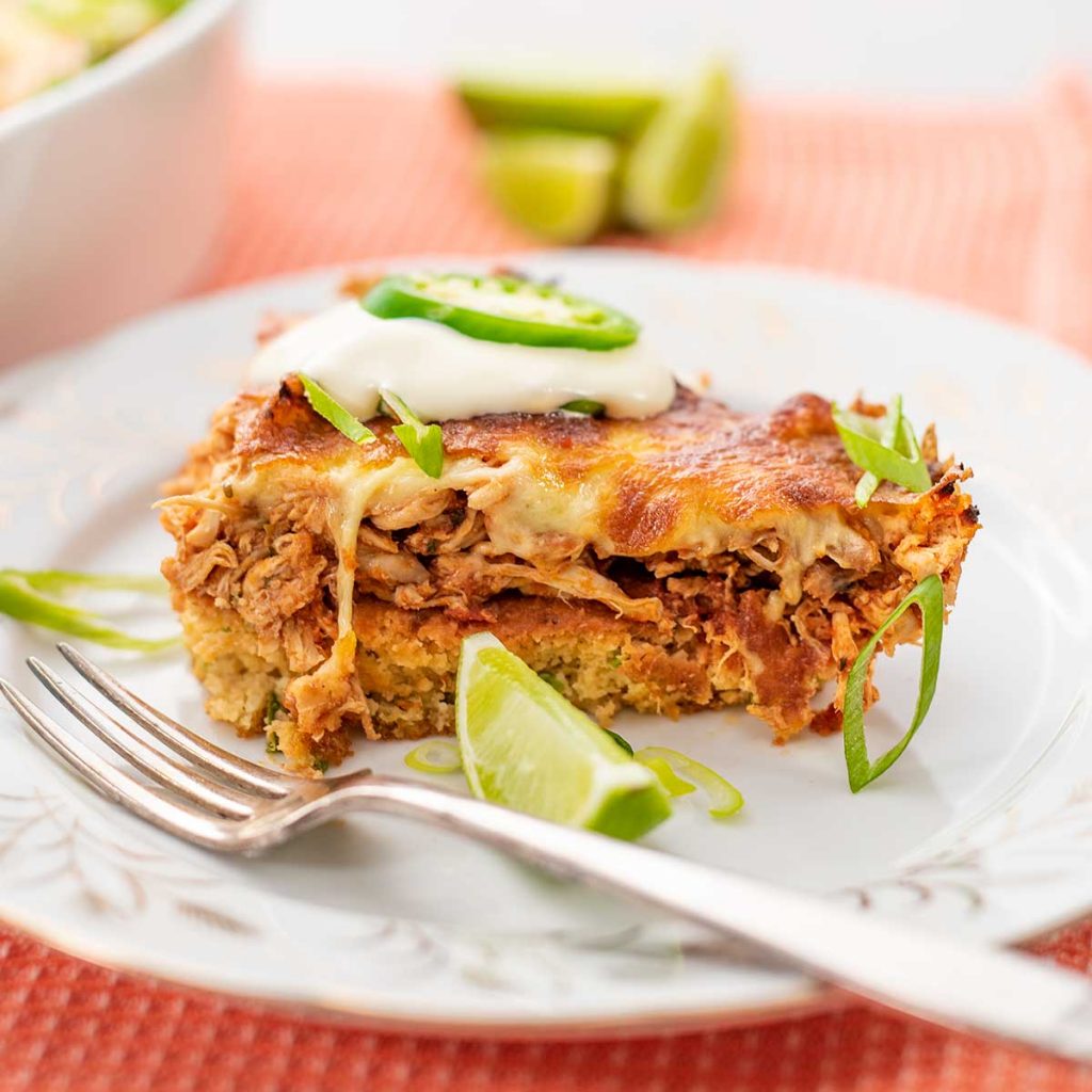 A slice of Keto Chicken Tamale Pie on a white plate