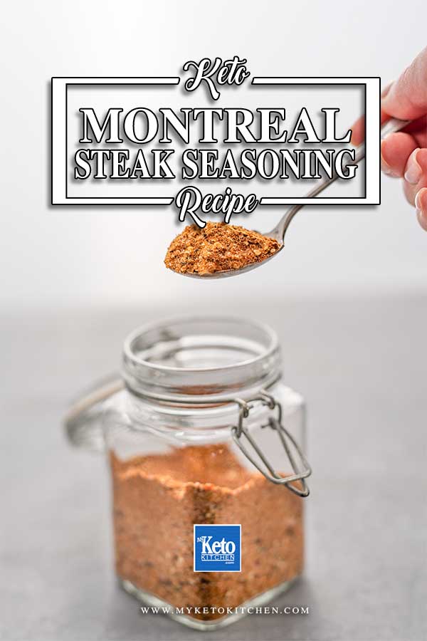 Montreal steak seasoning on a spoon being lifted from a glass jar