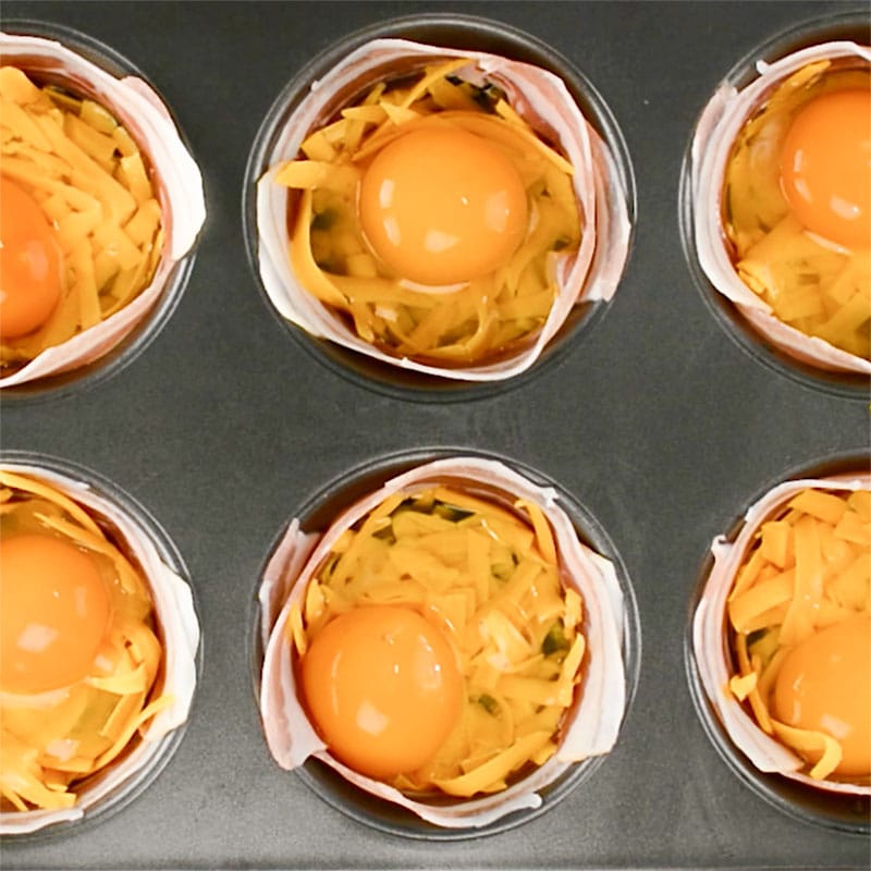 Pancetta Egg Cups in the tray, ready to bake.