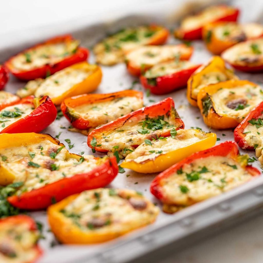 Keto Quest Stuffed Mini Peppers on a lined cookie sheet