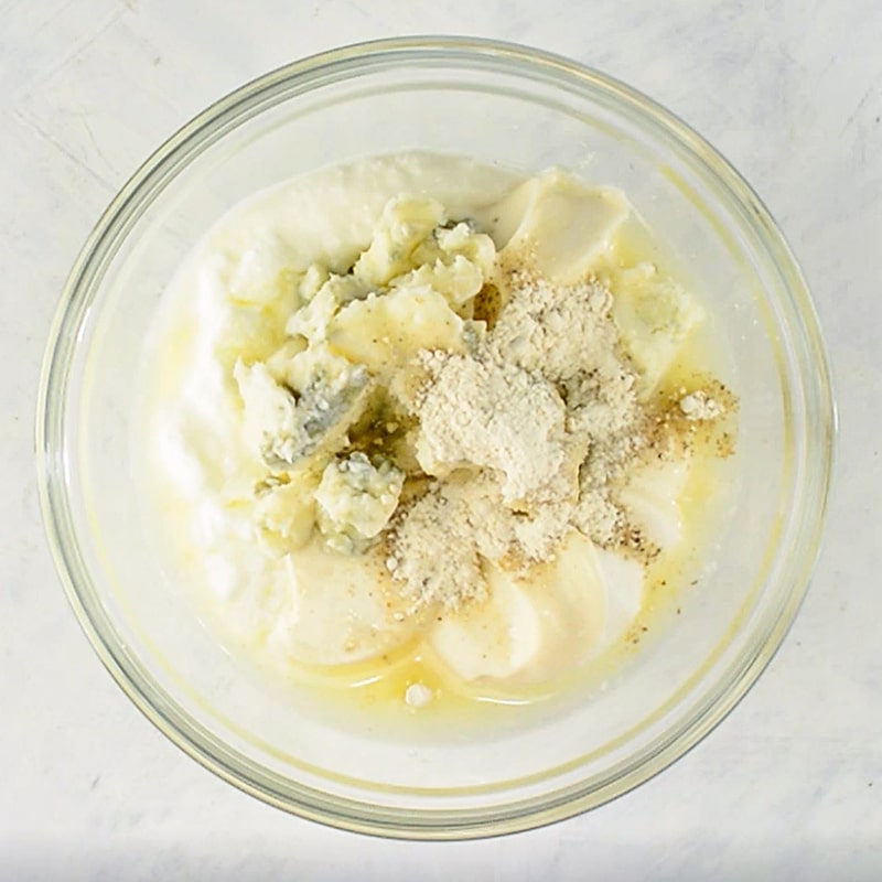 Blue Cheese Dressing Ingredients in a glass bowl