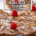 Keto Chocolate Peanut Butter Cookie Pizza with a slice missing on a white plate