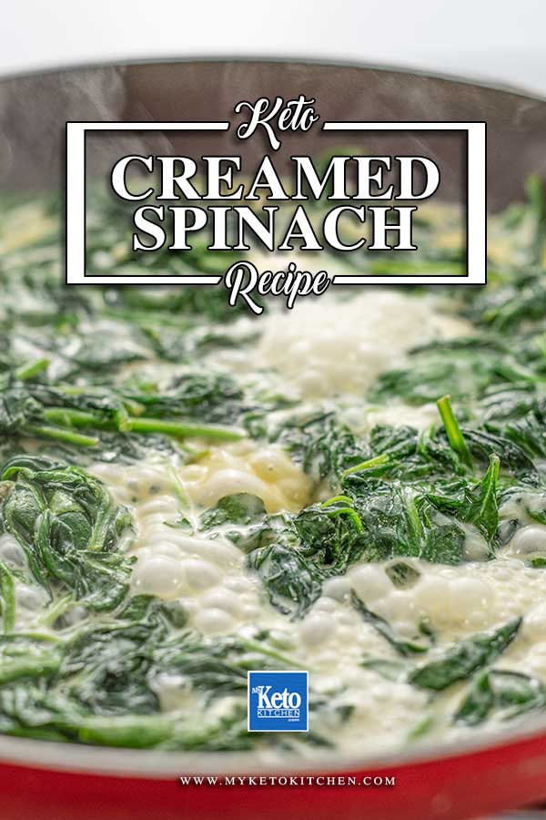 Keto Creamed Spinach simmering in a black frying pan