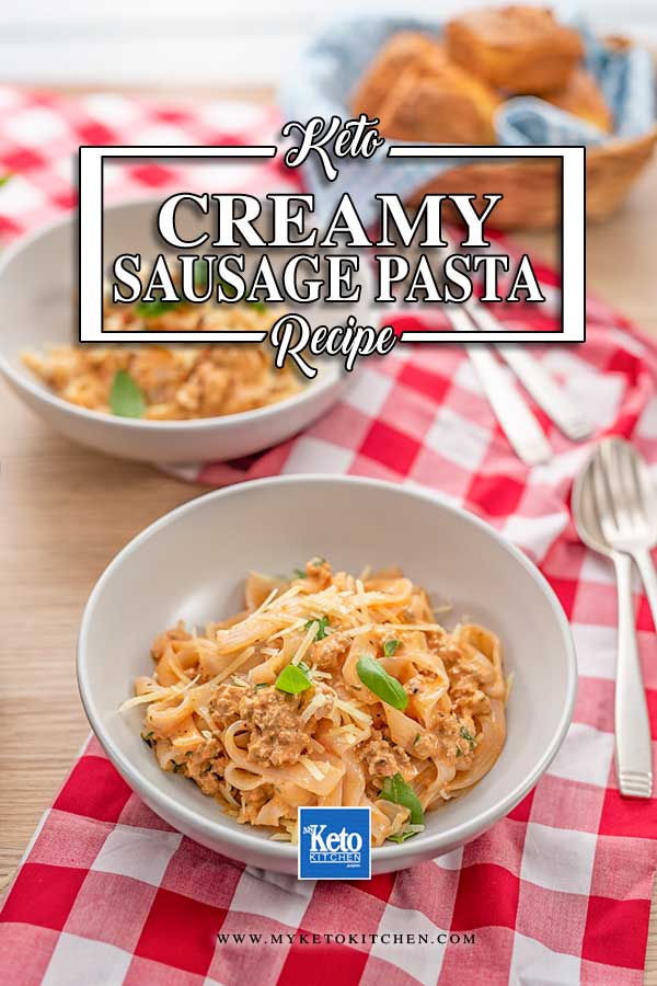 Keto Creamy Sausage Pasta in a grey bowl on a red checkered cloth