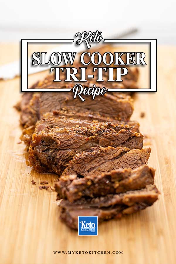 Slow Cooker Keto Tri Tip slices on a wooden board