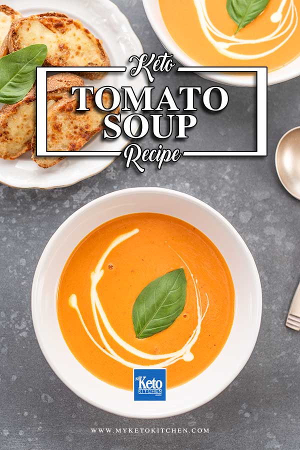 Keto Creamy Tomato Soup in a white bowl on a dark grey table
