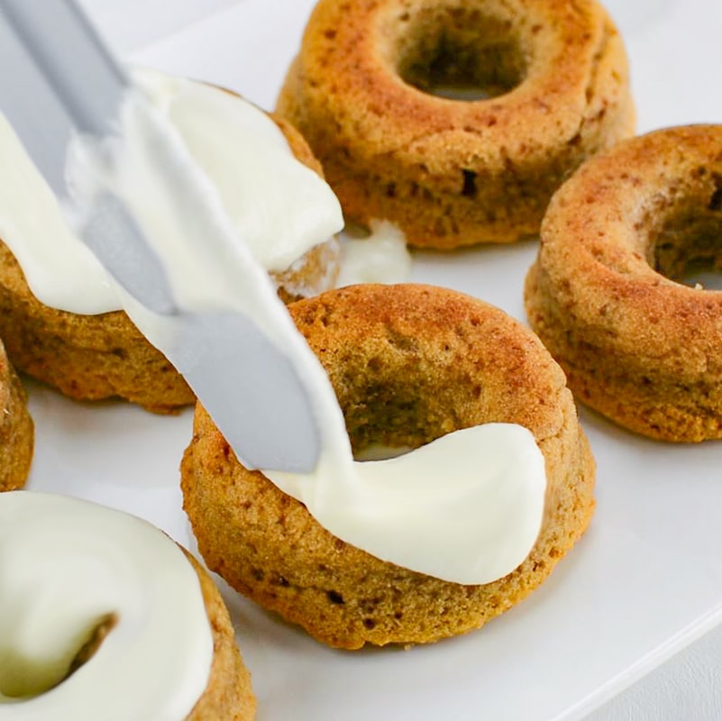 Frosting a Keto Cinnamon Glazed Donuts