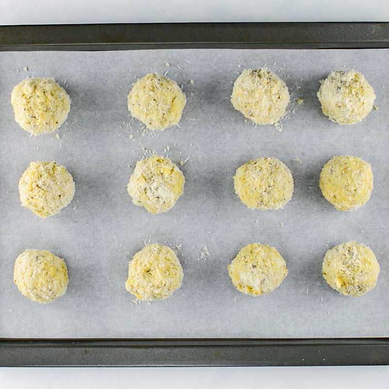 Keto Arancini Balls on a cookie sheet, ready to bake