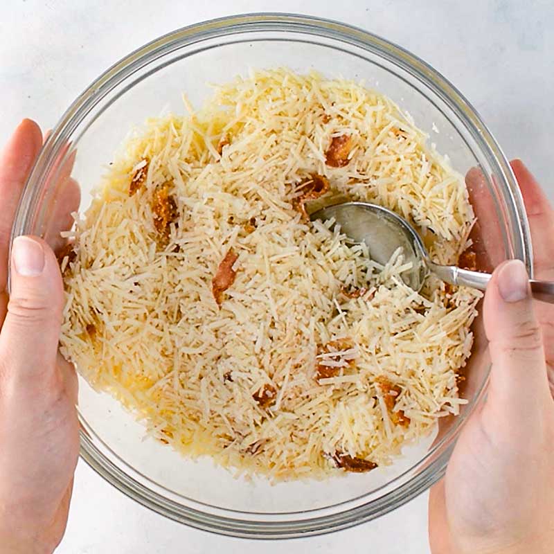 Keto Bacon Parmesan Chips ingredients in a mixing bowl