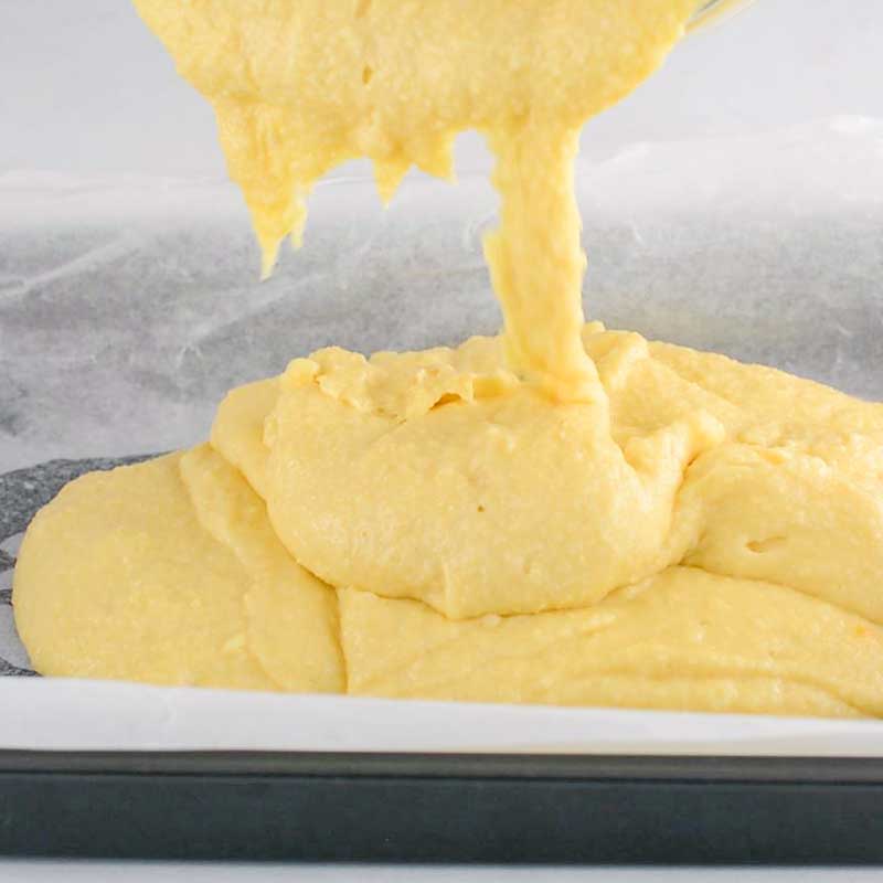 Keto Sheet Pan Pancake batter being poured into a pan
