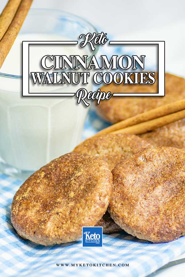 Keto Cinnamon Walnut Butter Cookies on a blue checked napkin with a glass of milk