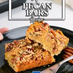 Keto Pecan Bars on a black plate on a white table
