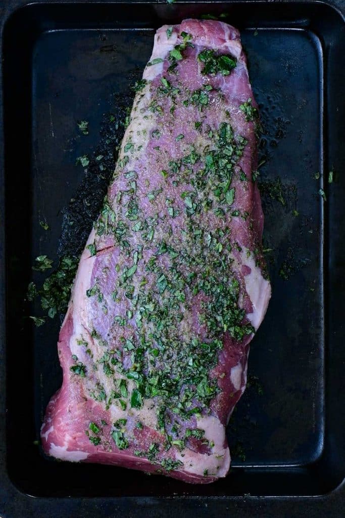 Tri-tip on a baking tray with dry rub.