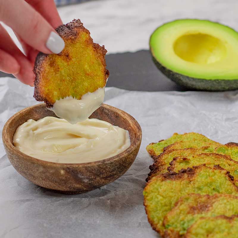 Keto Avocado Chips dipped into garlic aioli