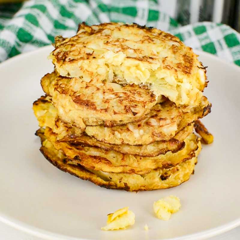 Keto Cabbage Hash Browns stacked on a plate