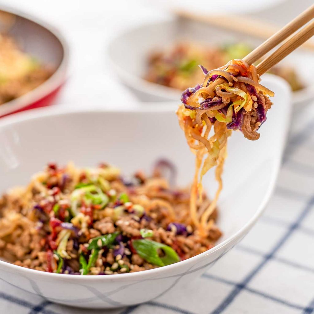 Keto Noodle Bowl in a white bowl on a checked cloth