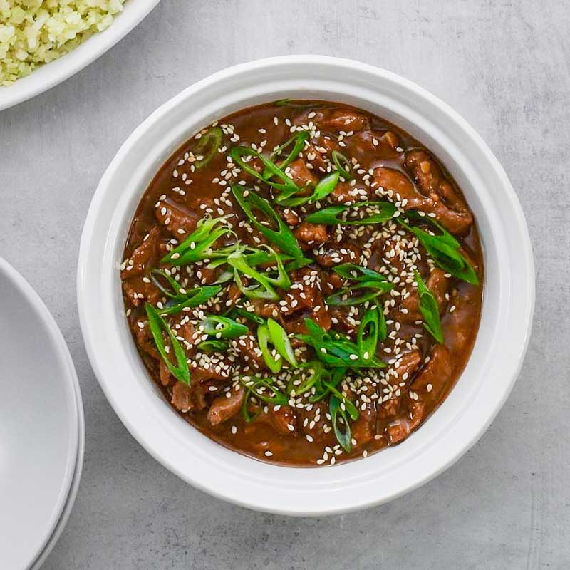 Keto Mongolian Beef in a white serving dish