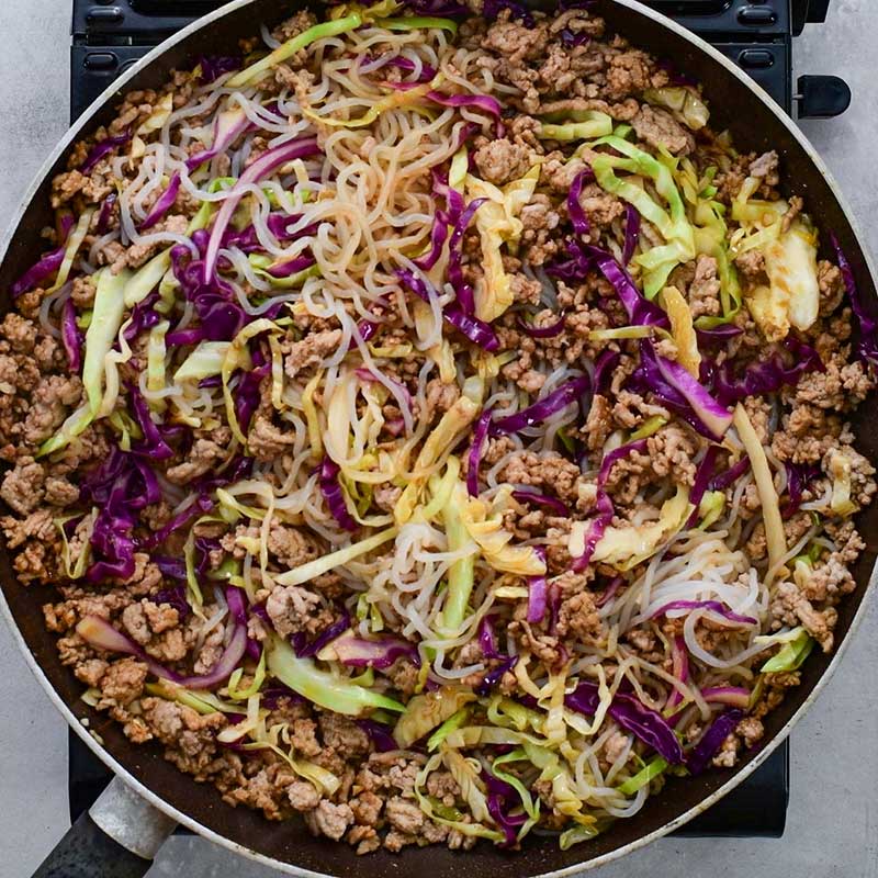 Keto Egg Roll Noodle Bowl Ingredients cooking in a frying pan