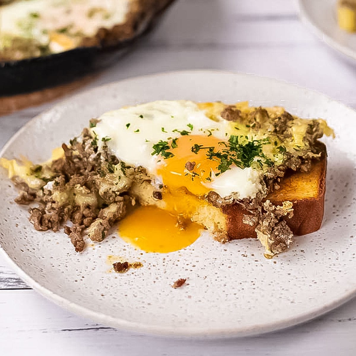 Carnivore baked eggs on a white plate.